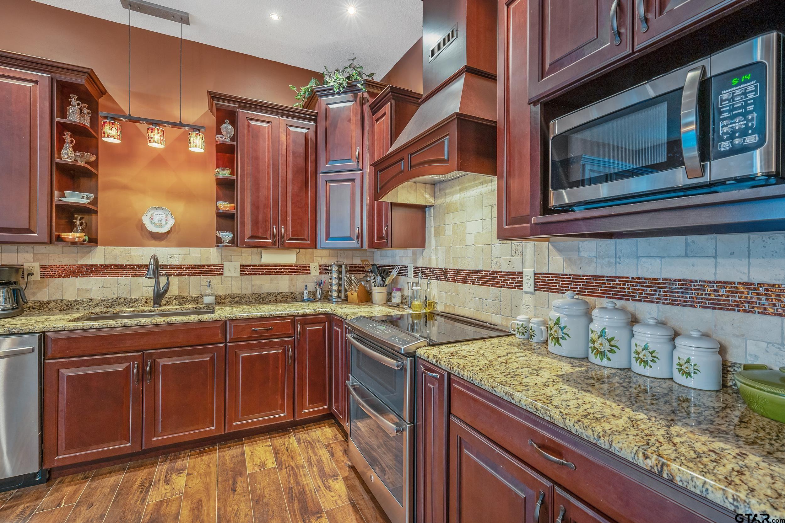 14375 County Road 384 Tyler, TX 75708 - Photo 32 of 48 a kitchen with a sink and cabinets