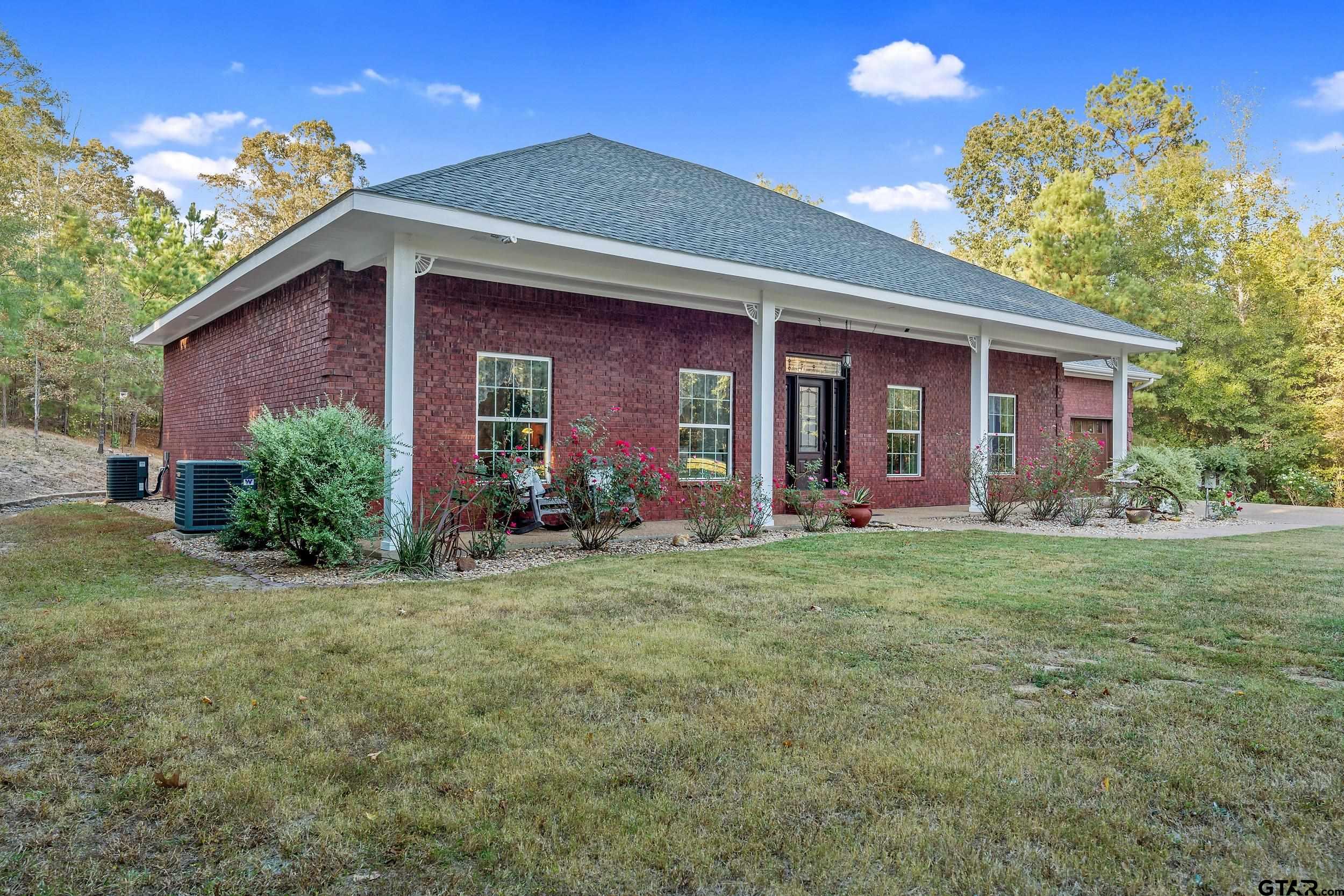 14375 County Road 384 Tyler, TX 75708 - Photo 38 of 48 a view of a house with yard and tree s