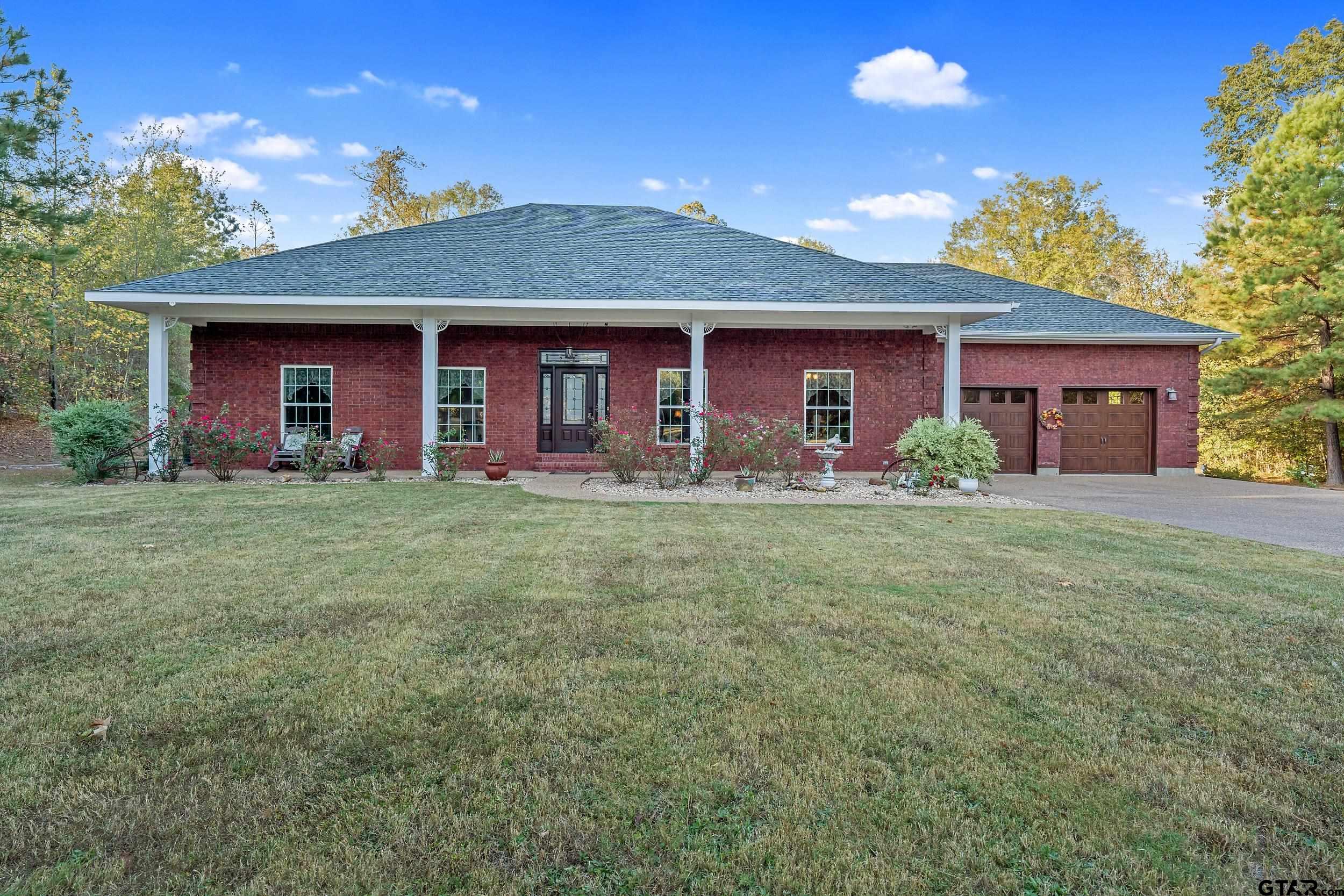 14375 County Road 384 Tyler, TX 75708 - Photo 39 of 48 a front view of a house with garden