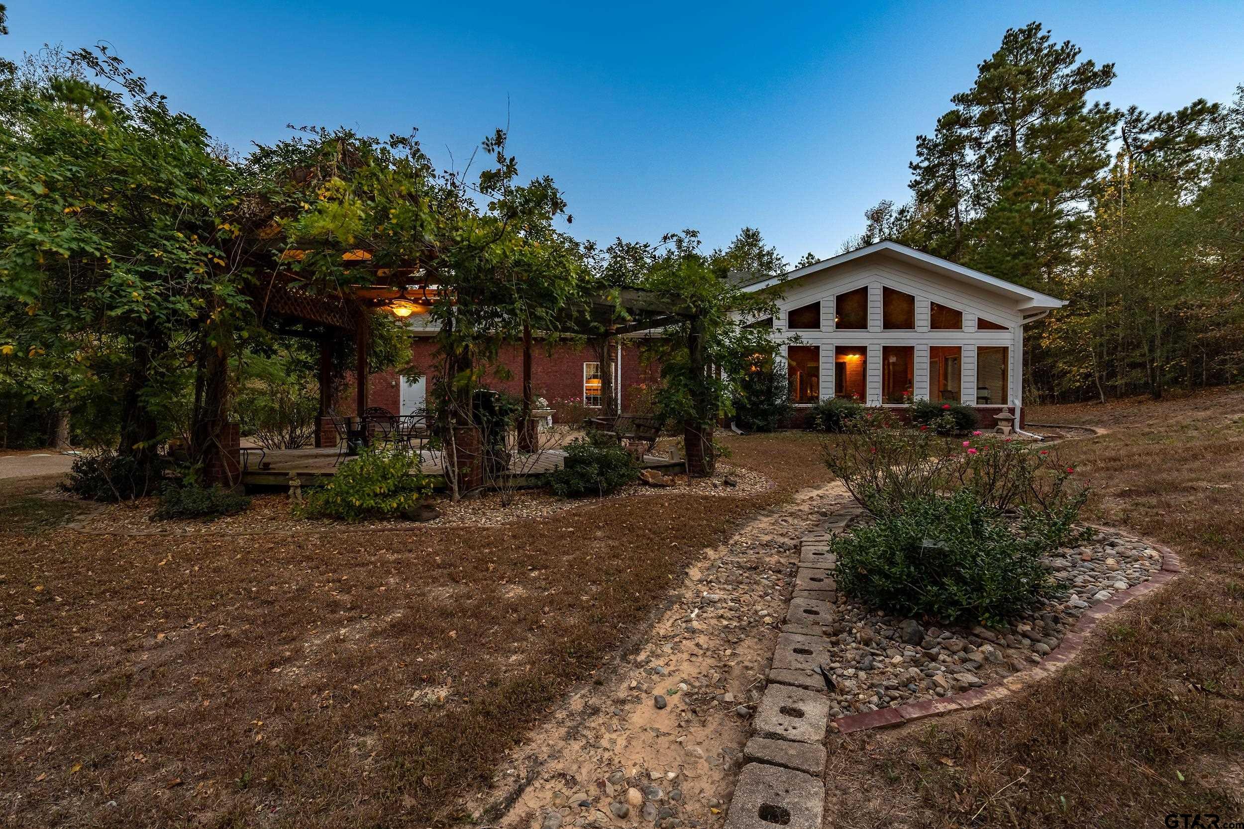 14375 County Road 384 Tyler, TX 75708 - Photo 44 of 48 a front view of a house with garden