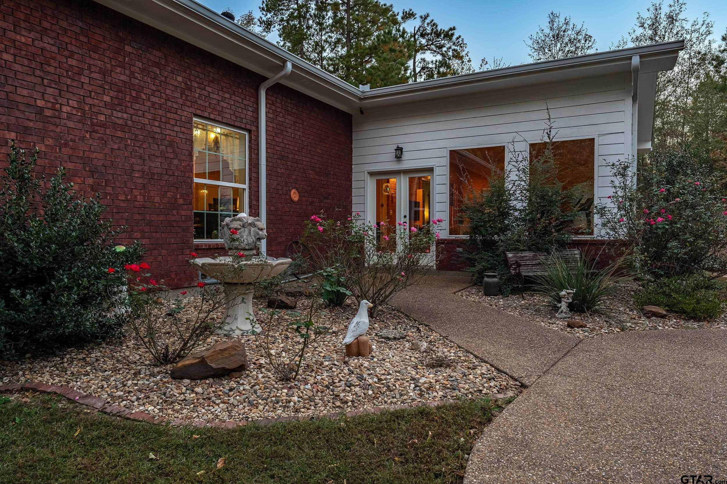 14375 County Road 384 Tyler, TX 75708 - Photo 45 of 48 a front view of a house with garden
