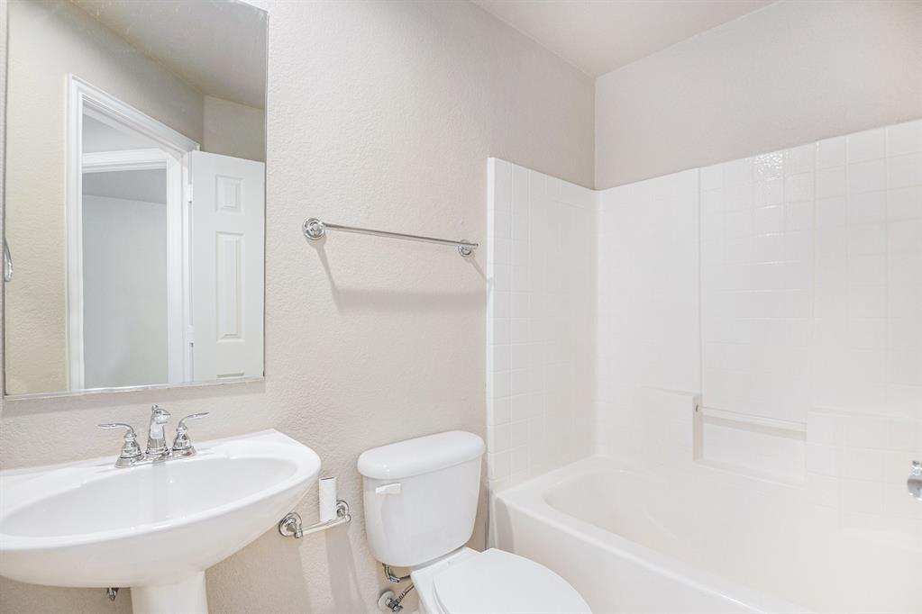 8313 Water Buck Run Fort Worth, TX 76179 - Photo 22 of 25 a bathroom with a sink toilet and shower