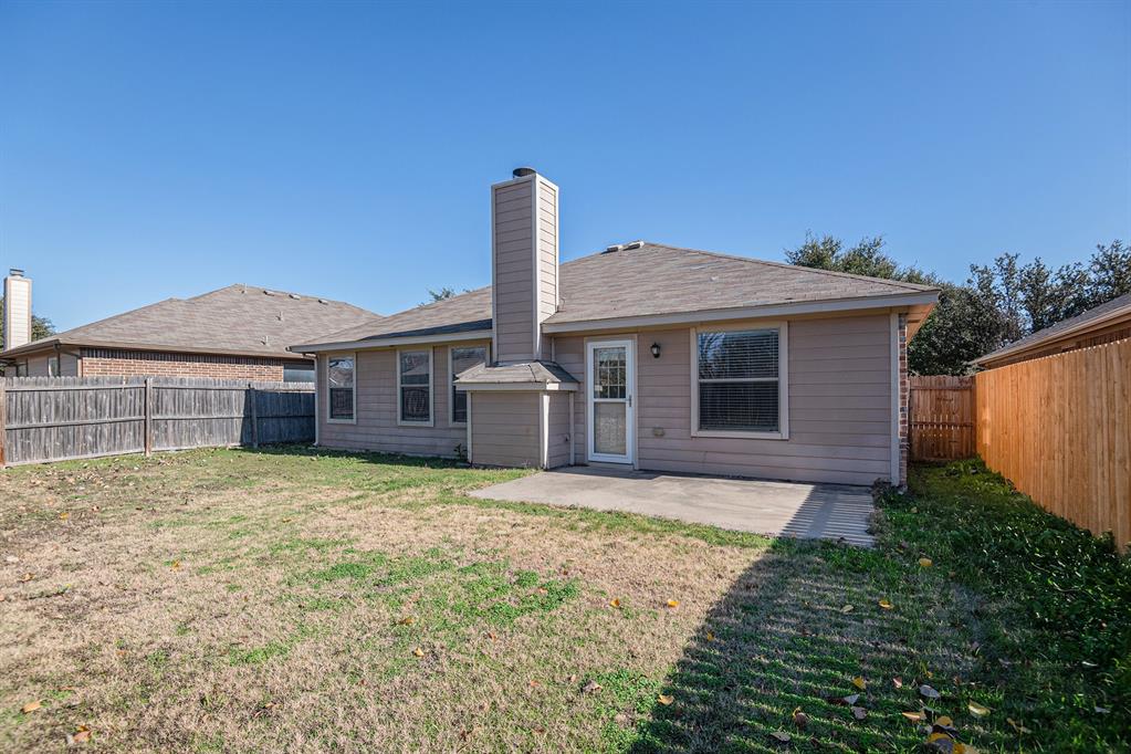 8313 Water Buck Run Fort Worth, TX 76179 - Photo 24 of 25 a front view of a house with a garden