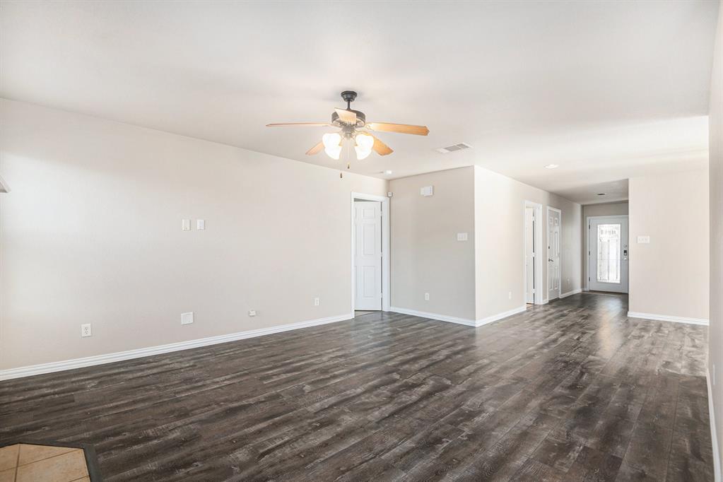 8313 Water Buck Run Fort Worth, TX 76179 - Photo 3 of 25 wooden floor in an empty room