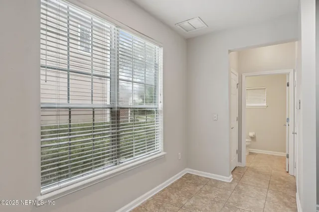 a view of a room that has a window in it