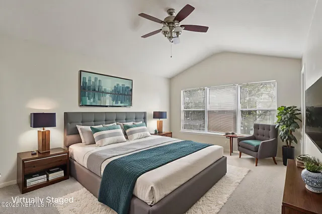 a bedroom with a large bed and a window