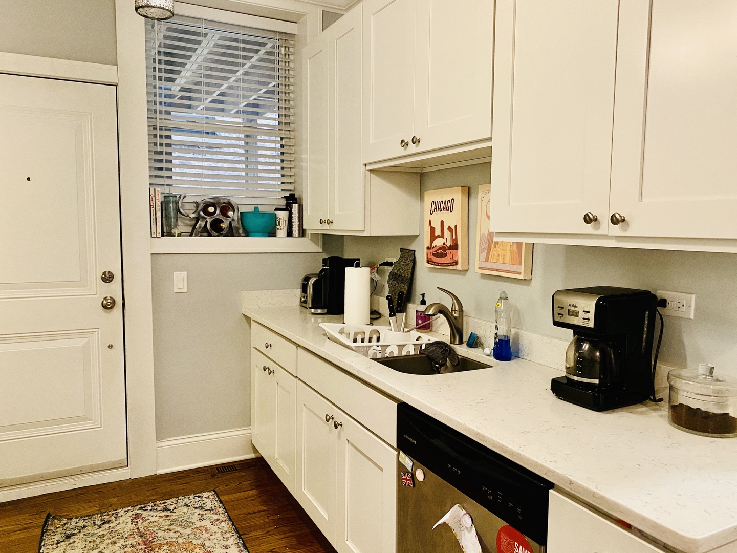 Undisclosed Address Chicago, IL 60657 - Photo 5 of 12 a kitchen with a sink and cabinets