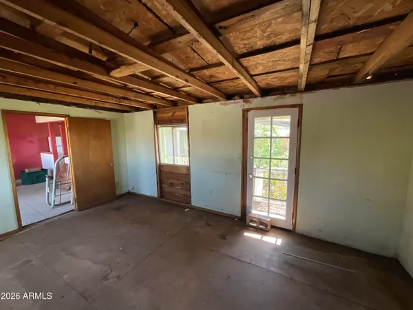 a view of hallway with wooden floor