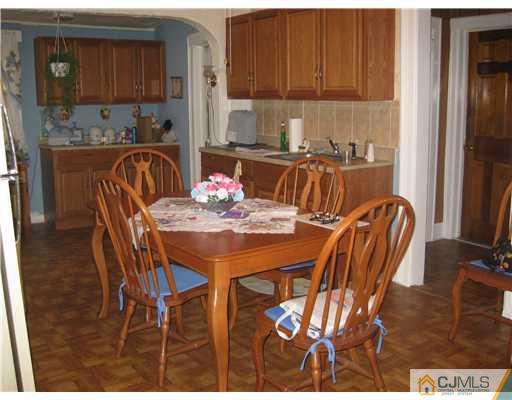 721 Lincoln Boulevard Middlesex, NJ 08846 - Photo 6 of 10 a dining room with furniture and wooden floor