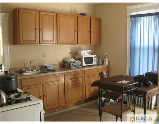 721 Lincoln Boulevard Middlesex, NJ 08846 - Photo 8 of 10 a kitchen with stainless steel appliances granite countertop a sink and cabinets