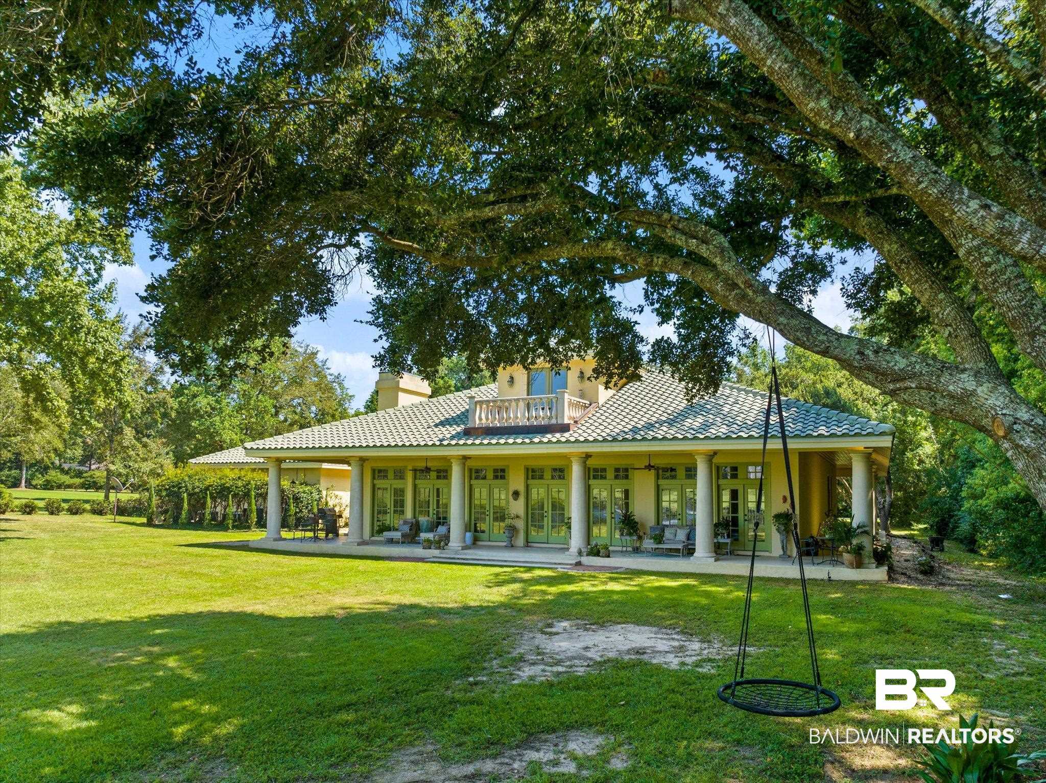 6341 Raintree Road Fairhope, AL 36532 - Photo 26 of 40 Rear view of house with a yard