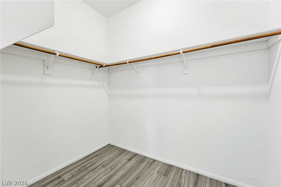 6245 Andover Wood Road Las Vegas, NV 89113 - Photo 22 of 37 Ample hanging space for an organized wardrobe, complete with durable flooring.