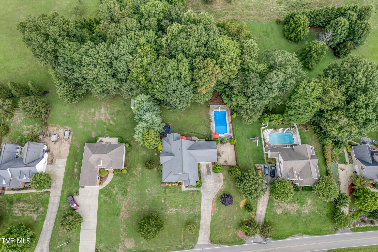 1828 Weaver Branch Road Piney Flats, TN 37686 - Photo 17 of 54 an aerial view of residential house with outdoor space and trees all around