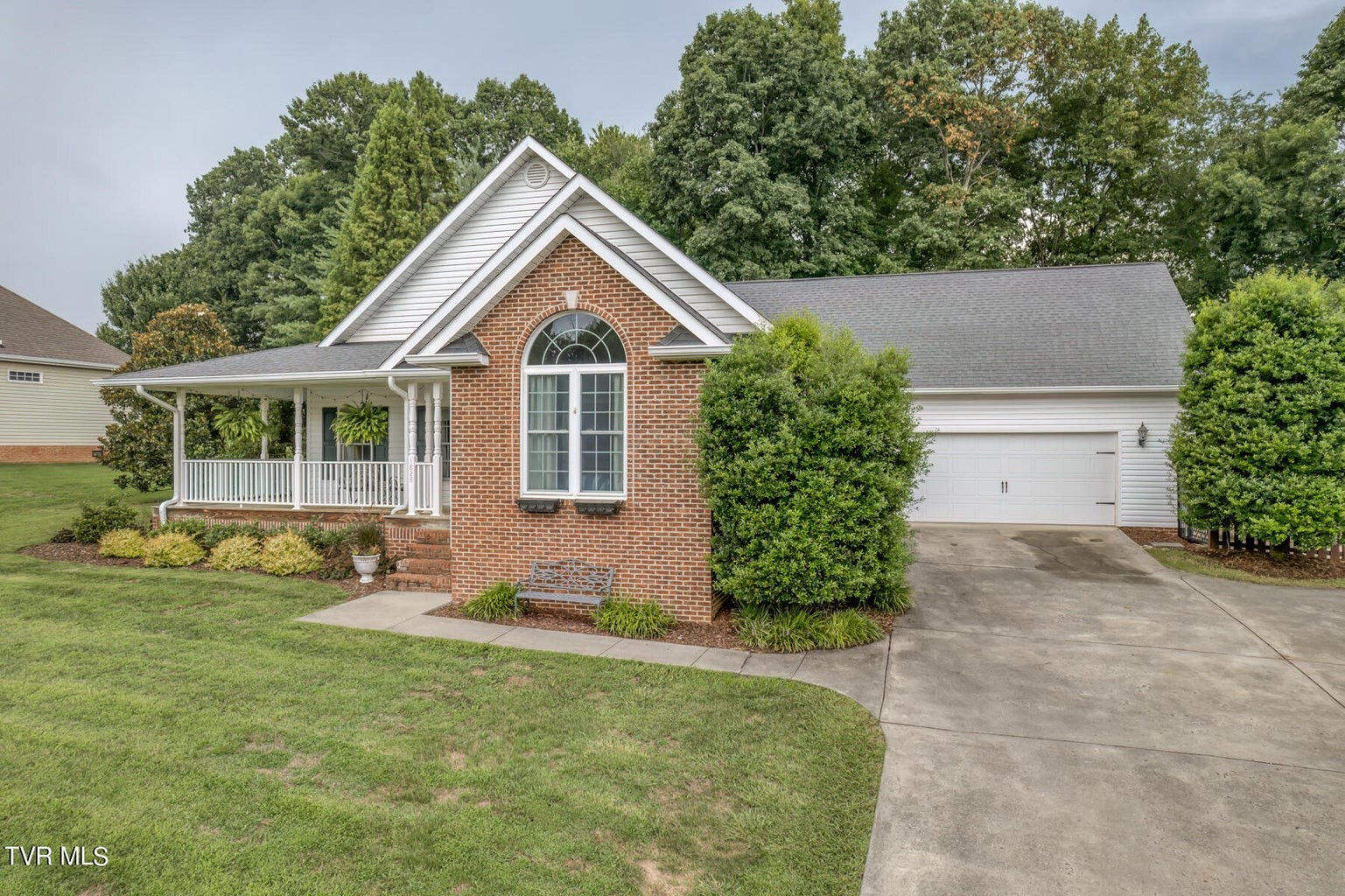 1828 Weaver Branch Road Piney Flats, TN 37686 - Photo 18 of 54 a front view of a house with a yard