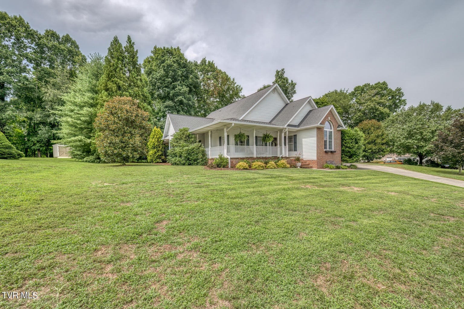 1828 Weaver Branch Road Piney Flats, TN 37686 - Photo 2 of 54 a front view of a house with garden