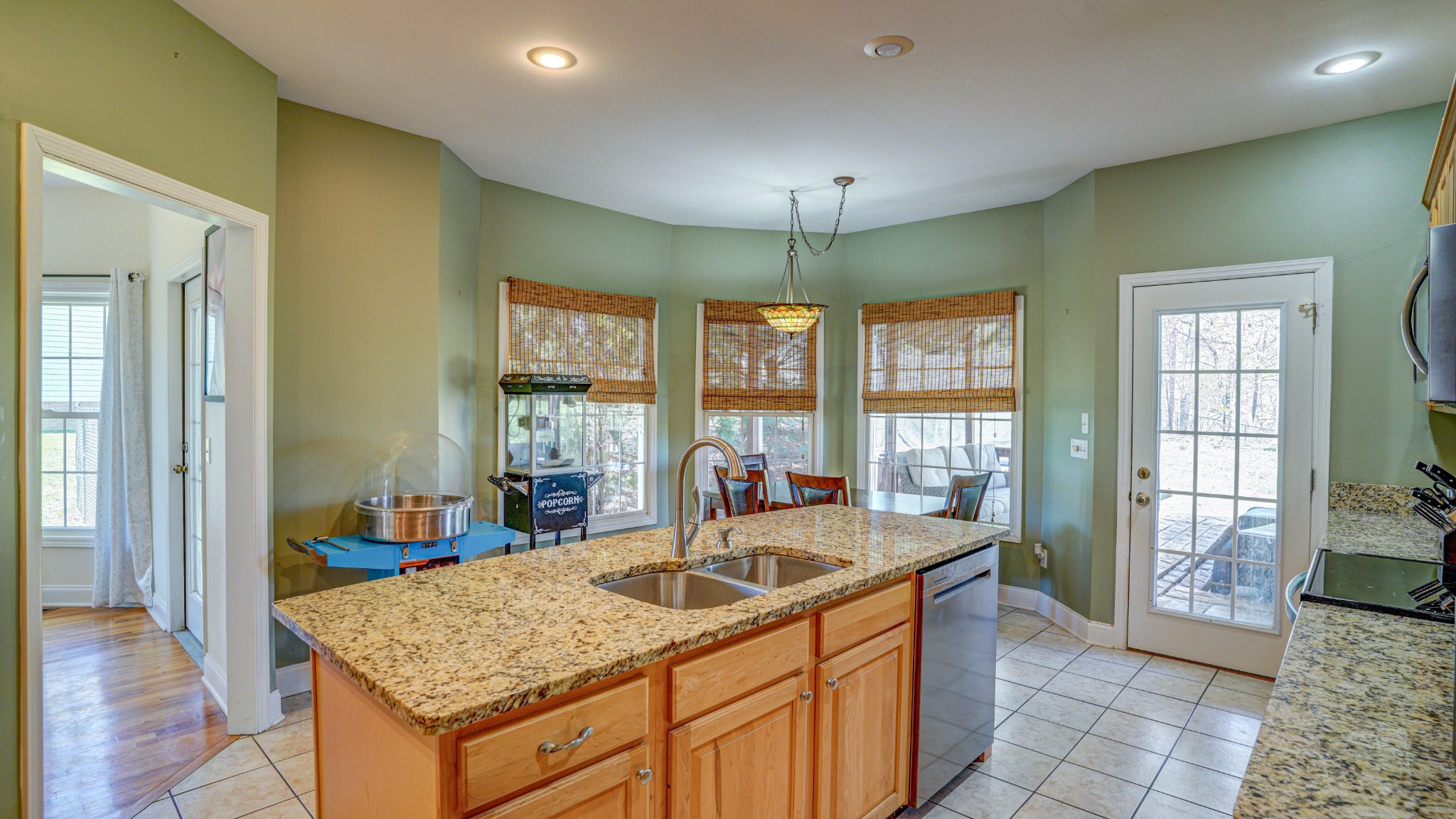 1828 Weaver Branch Road Piney Flats, TN 37686 - Photo 32 of 54 a kitchen with stainless steel appliances granite countertop a sink and a refrigerator