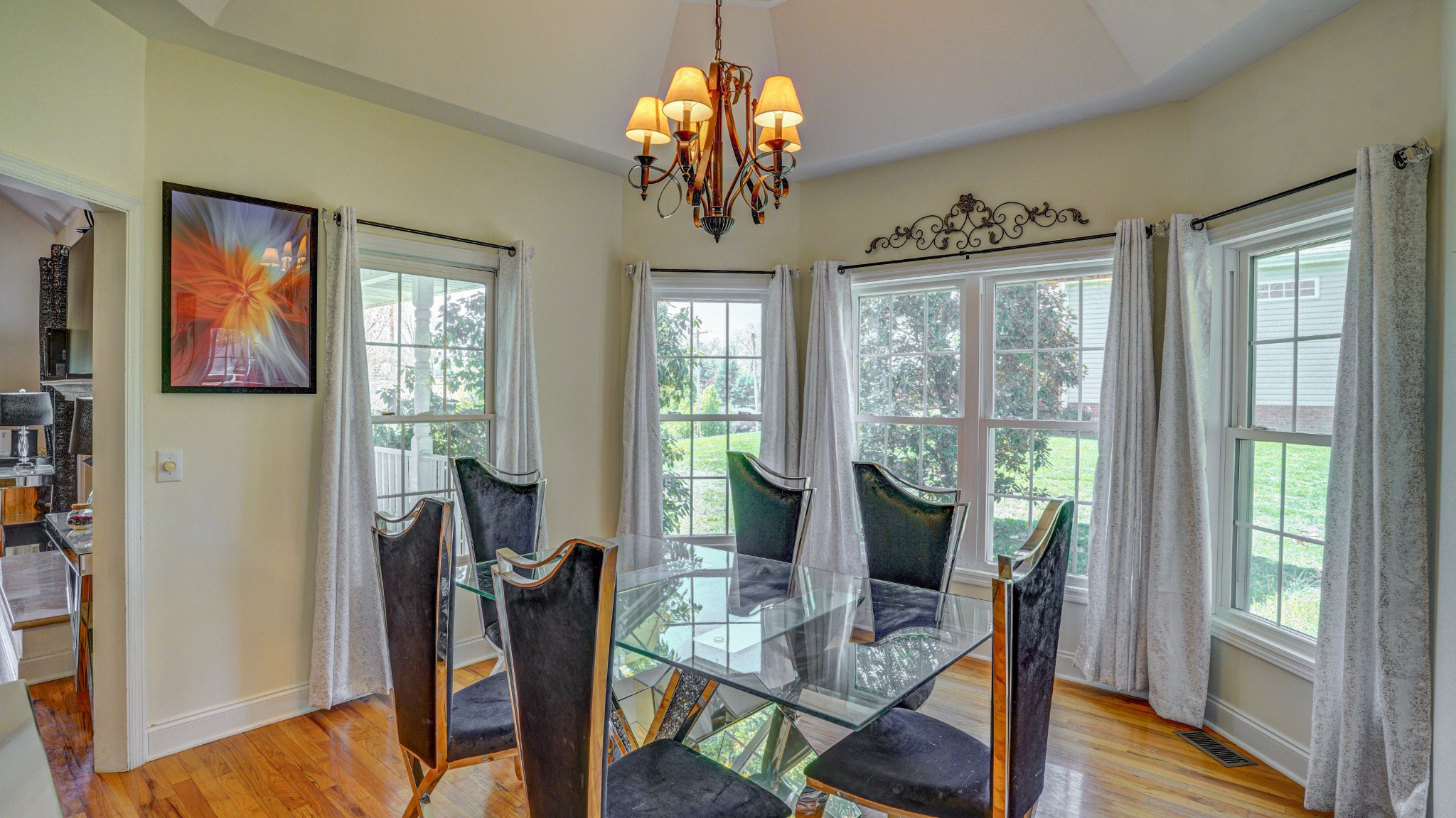 1828 Weaver Branch Road Piney Flats, TN 37686 - Photo 35 of 54 a view of a dining room with furniture a chandelier and wooden floor