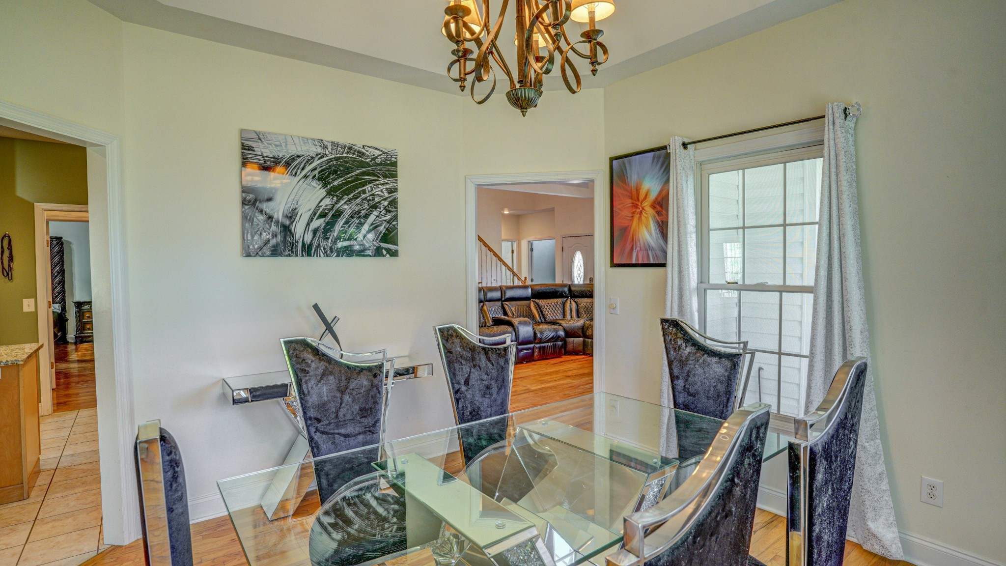 1828 Weaver Branch Road Piney Flats, TN 37686 - Photo 36 of 54 a view of a dining room with furniture a chandelier and wooden floor