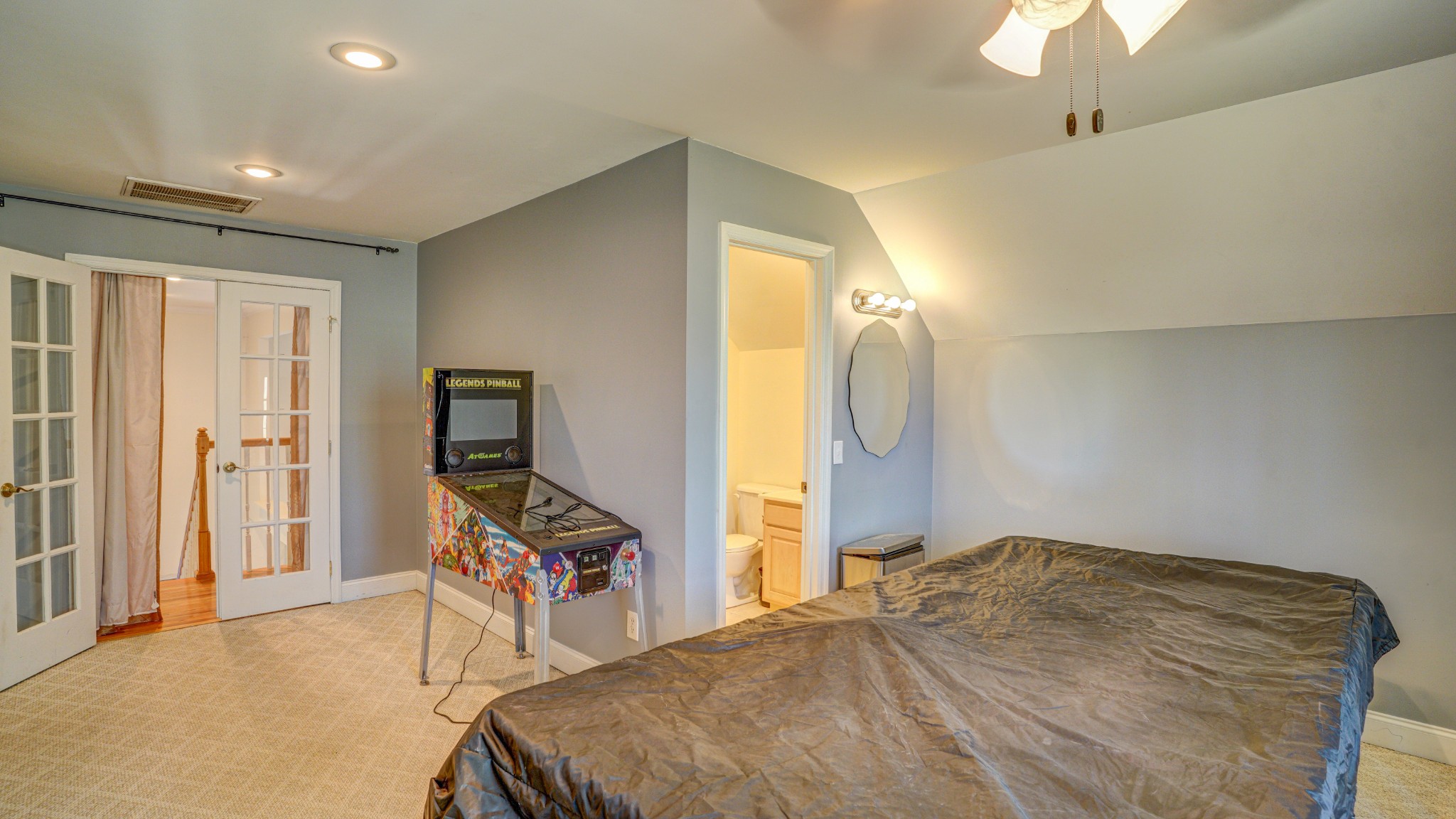 1828 Weaver Branch Road Piney Flats, TN 37686 - Photo 51 of 54 a bedroom with a bed and a chandelier