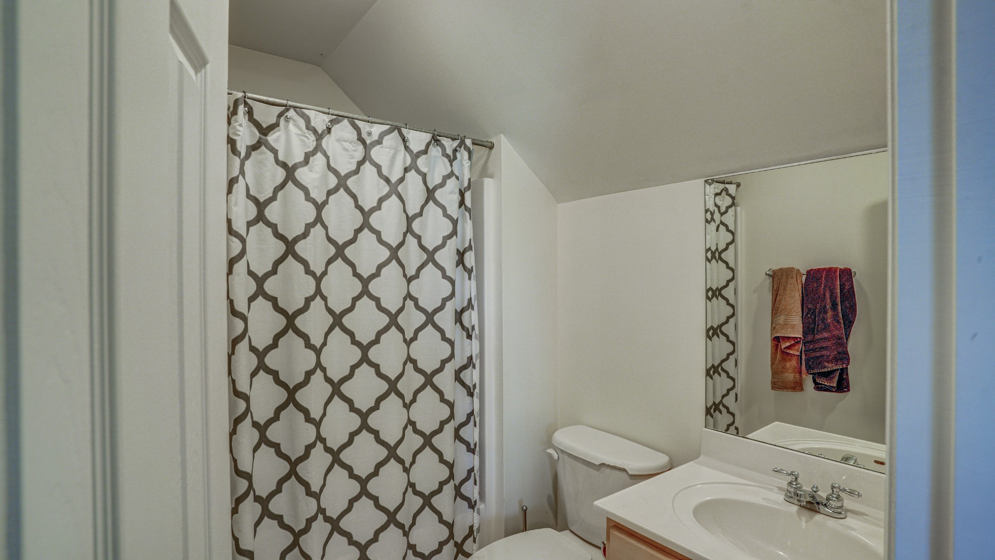 1828 Weaver Branch Road Piney Flats, TN 37686 - Photo 53 of 54 a bathroom with a toilet and shower curtain