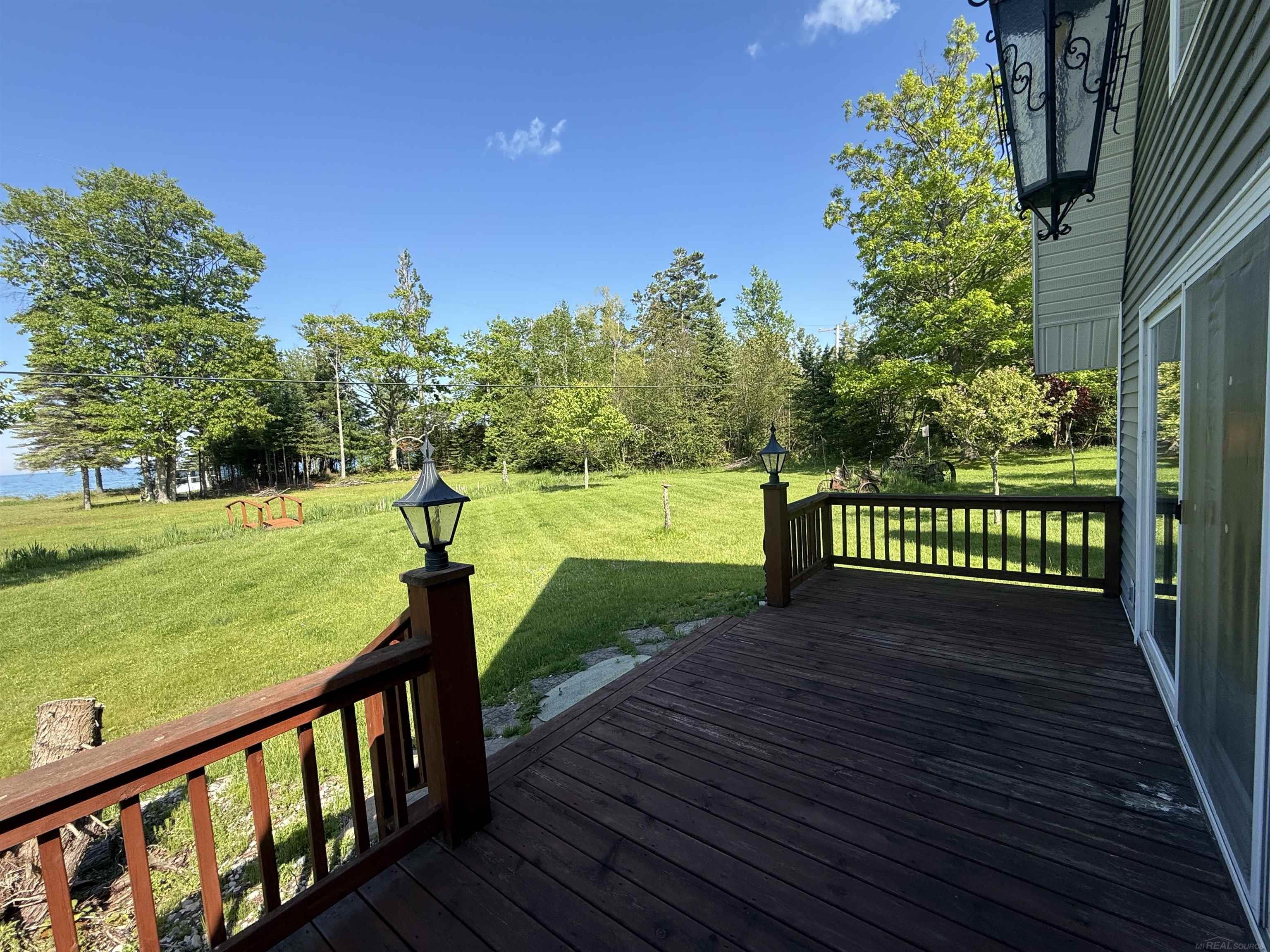 2125 Mckechnie Road Harrisville, MI 48740 - Photo 39 of 61 Enjoy the sunrise with your morning coffee from deck or stroll down to the beach house to avoid occasional inclement weather