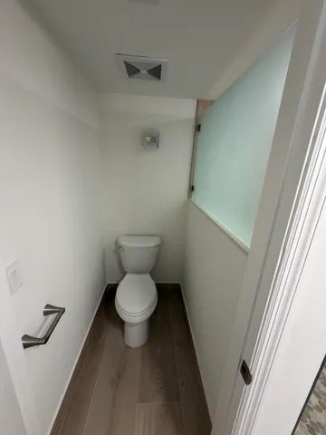 a bathroom with a toilet and a sink