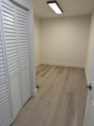 an empty room with a wooden floor