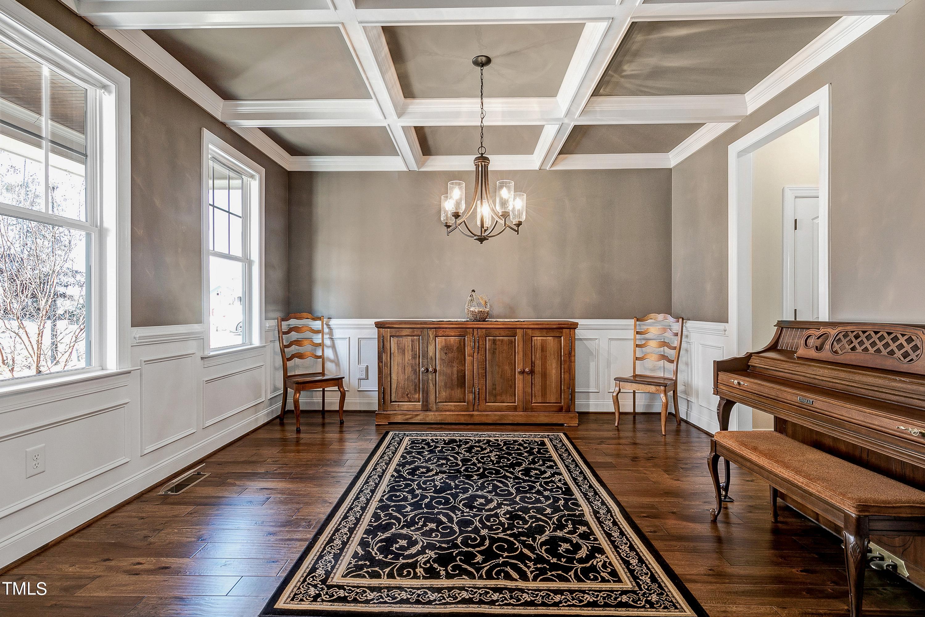 8533 Hurst Drive Raleigh, NC 27603 - Photo 2 of 43 an entryway with wooden floor and chandelier