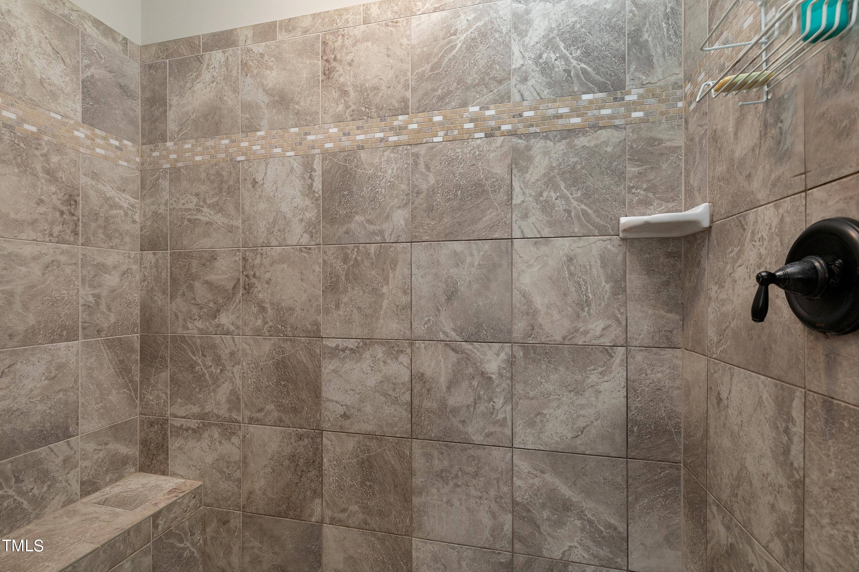 8533 Hurst Drive Raleigh, NC 27603 - Photo 23 of 43 a bathroom with a shower