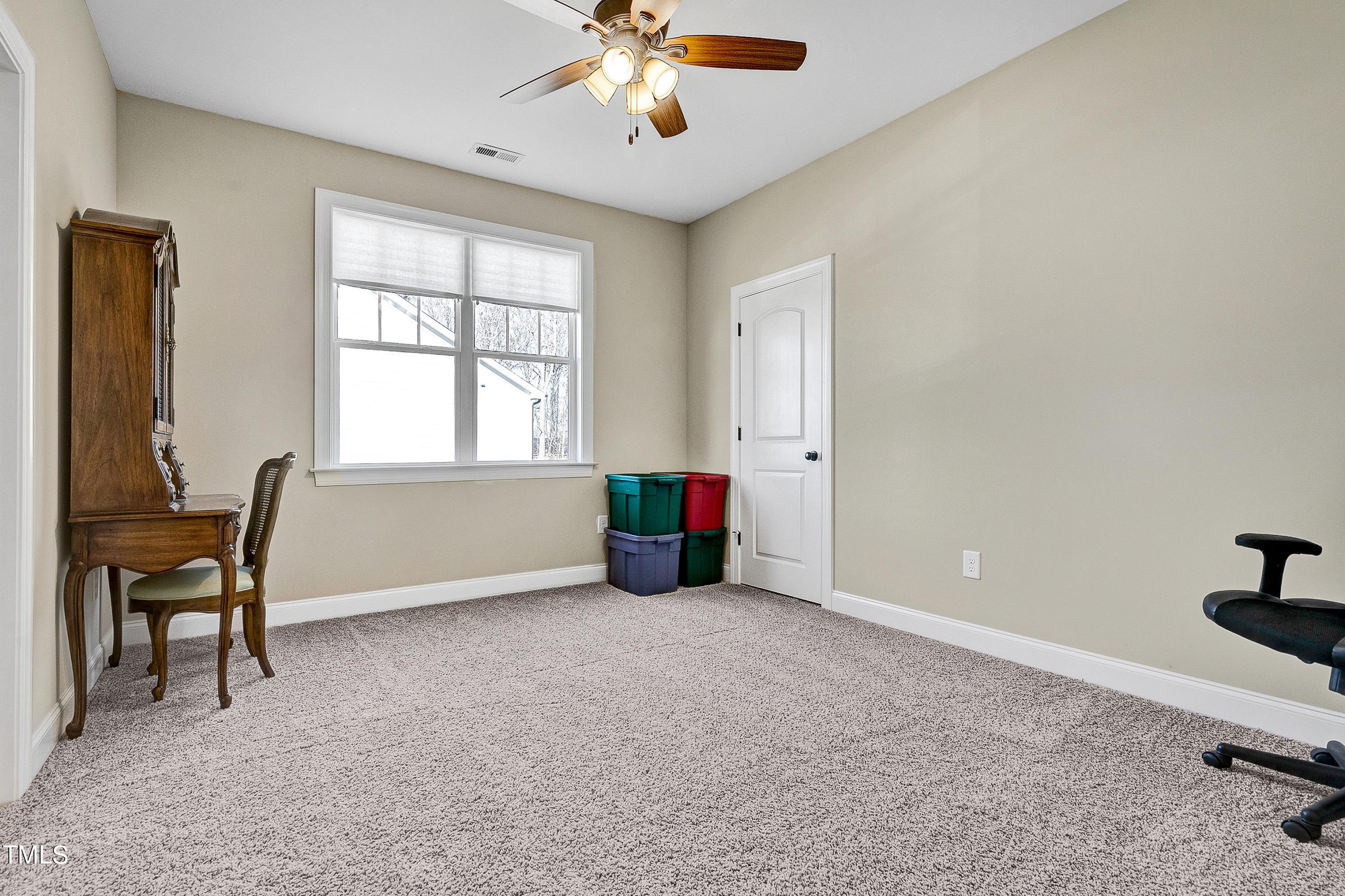 8533 Hurst Drive Raleigh, NC 27603 - Photo 27 of 43 a view of a workspace with furniture and a window