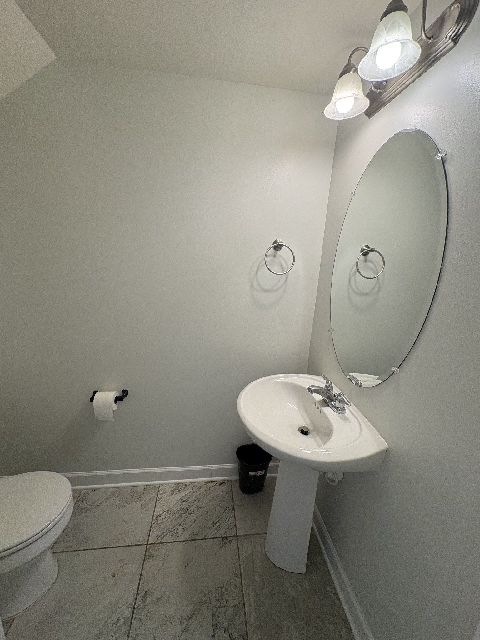 735 Tulip Grove Road, Unit 303 Hermitage, TN 37076 - Photo 5 of 16 a bathroom with a toilet sink and mirror