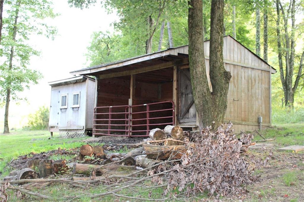 127 Rockdale Road Butler, PA 16002 - Photo 22 of 25 Outbuilding - Run in Horse Barn with 2 stalls, tack room with water & electric + chicken coop