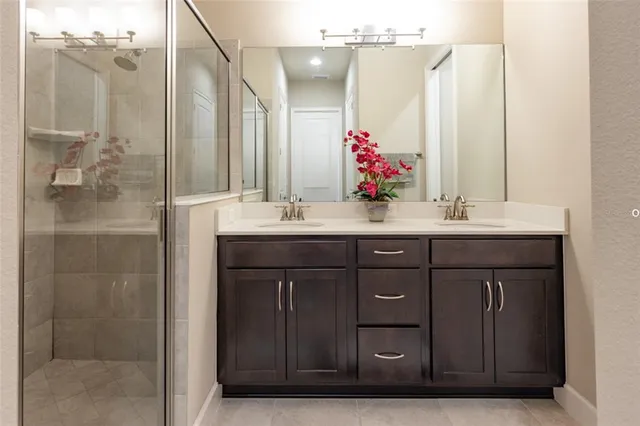 a bathroom with a sink vanity and a mirror