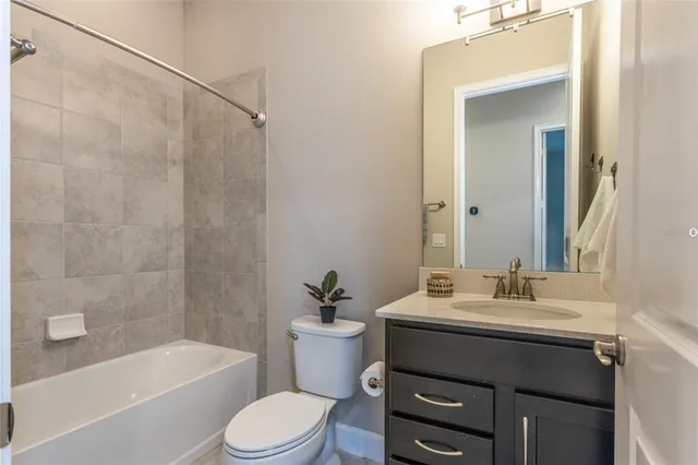 a bathroom with a sink a toilet and a bathtub