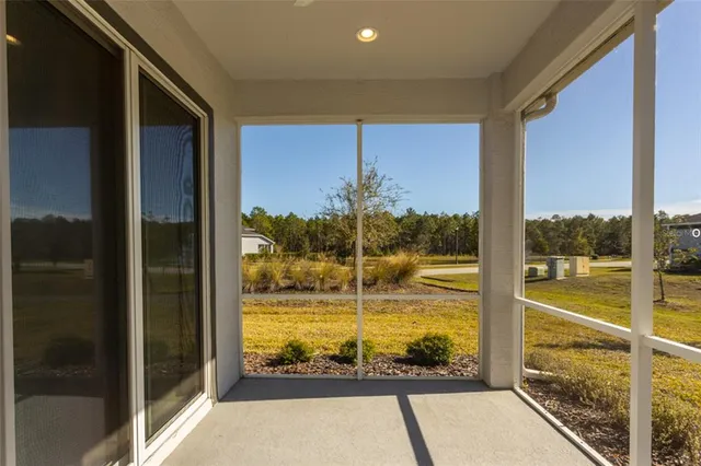 a view of a glass door and an outdoor space