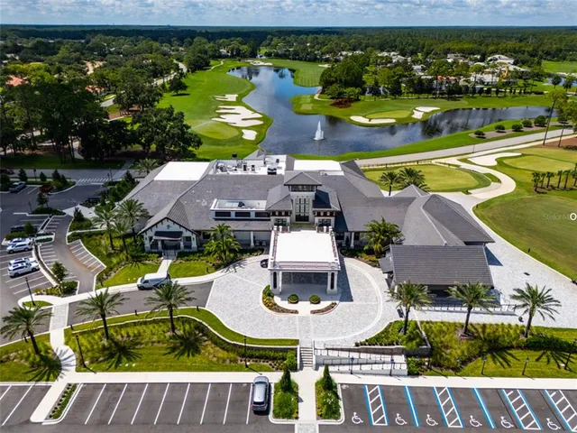 an aerial view of a house with a swimming pool yard and outdoor seating