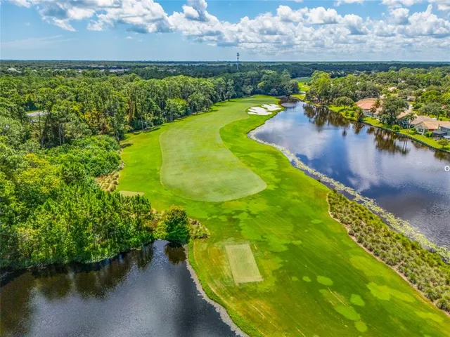 a view of a golf course with a lake