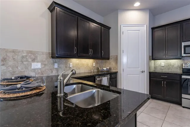 a kitchen with a sink and cabinets