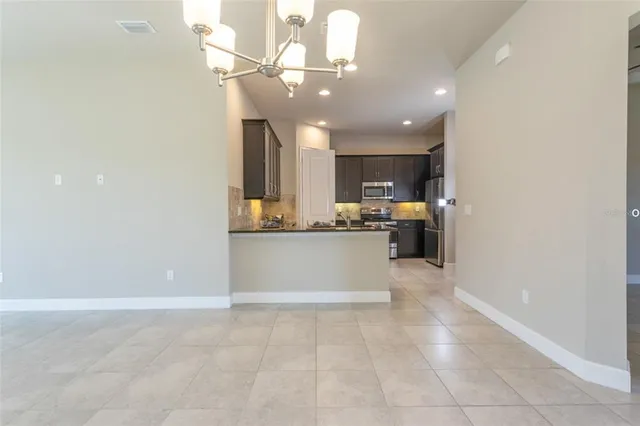 a view of a kitchen with a sink and cabinets