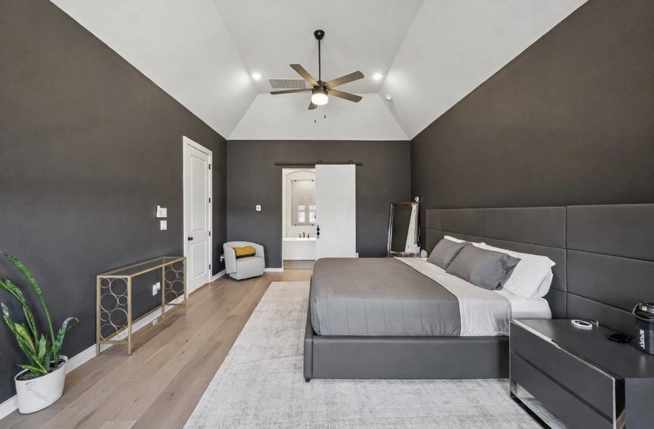 8703 Blue Grotto Lane Manvel, TX 77578 - Photo 16 of 43 The custom paint gives this room a moody, high-end vibe complete with barn door leading to the ensuite.