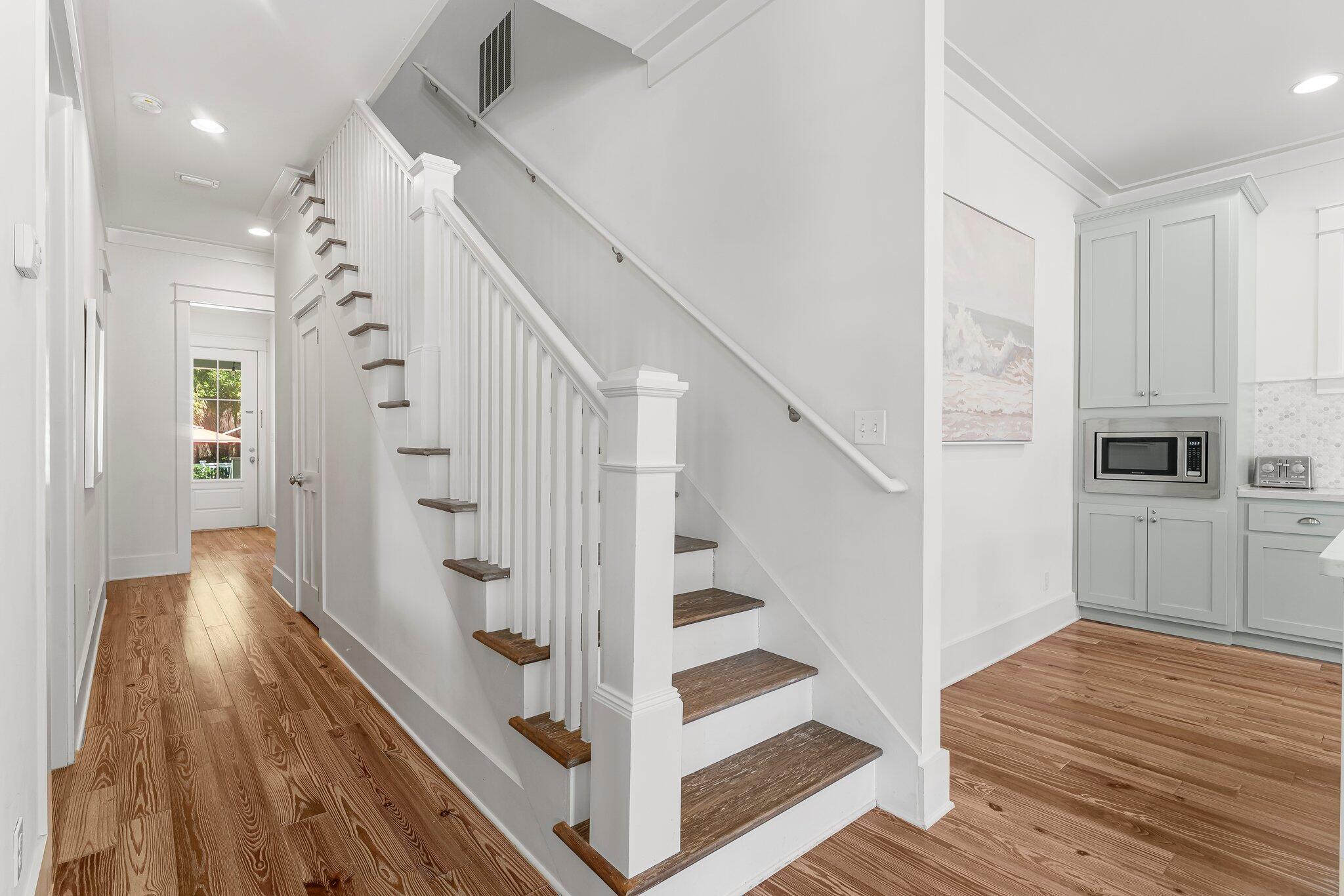 515 Seacrest Drive Inlet Beach, FL 32461 - Photo 17 of 62 a view of a hallway with wooden floor and staircase