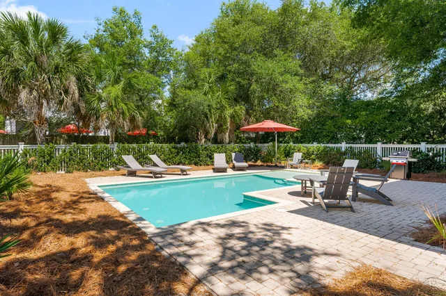 a view of a house with swimming pool and porch