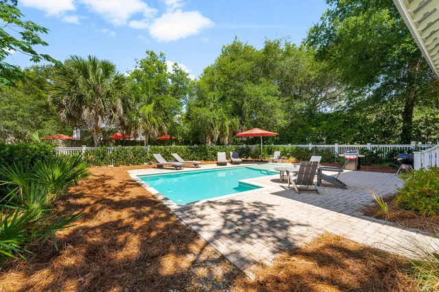 an aerial view of residential house with outdoor space and swimming pool