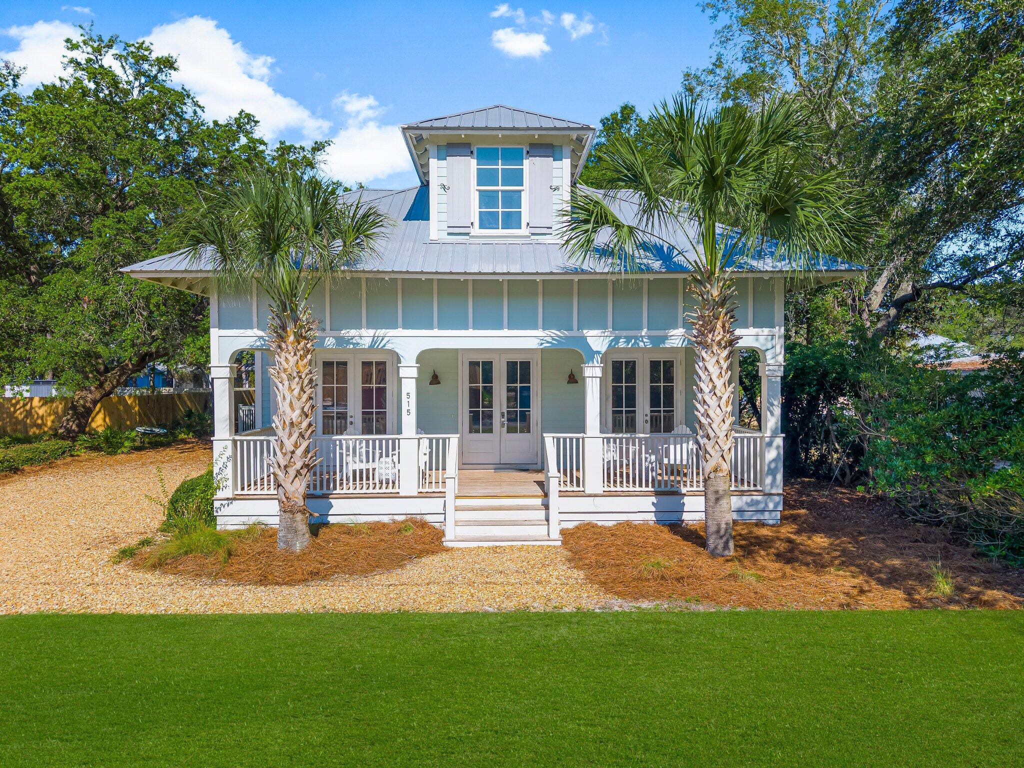 515 Seacrest Drive Inlet Beach, FL 32461 - Photo 2 of 62 a front view of a house with a yard