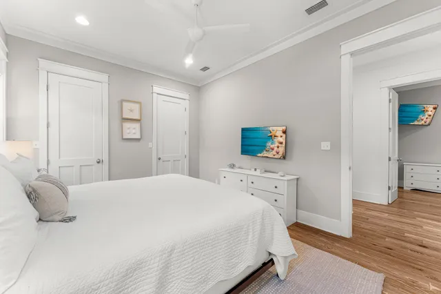 a bathroom with a sink a toilet and a window
