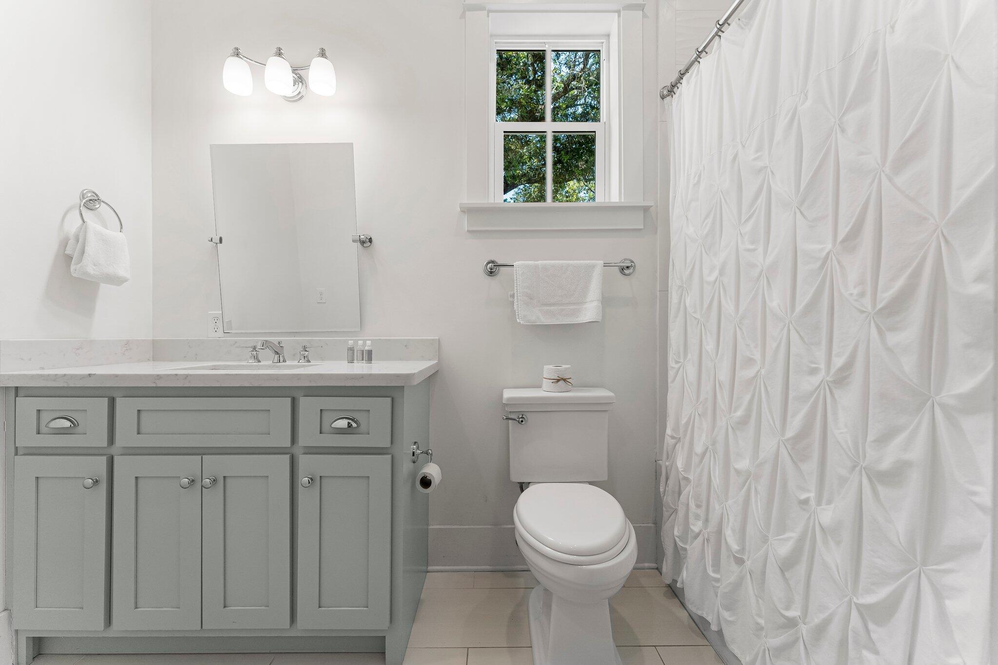 515 Seacrest Drive Inlet Beach, FL 32461 - Photo 35 of 62 a bathroom with a sink a toilet and a window