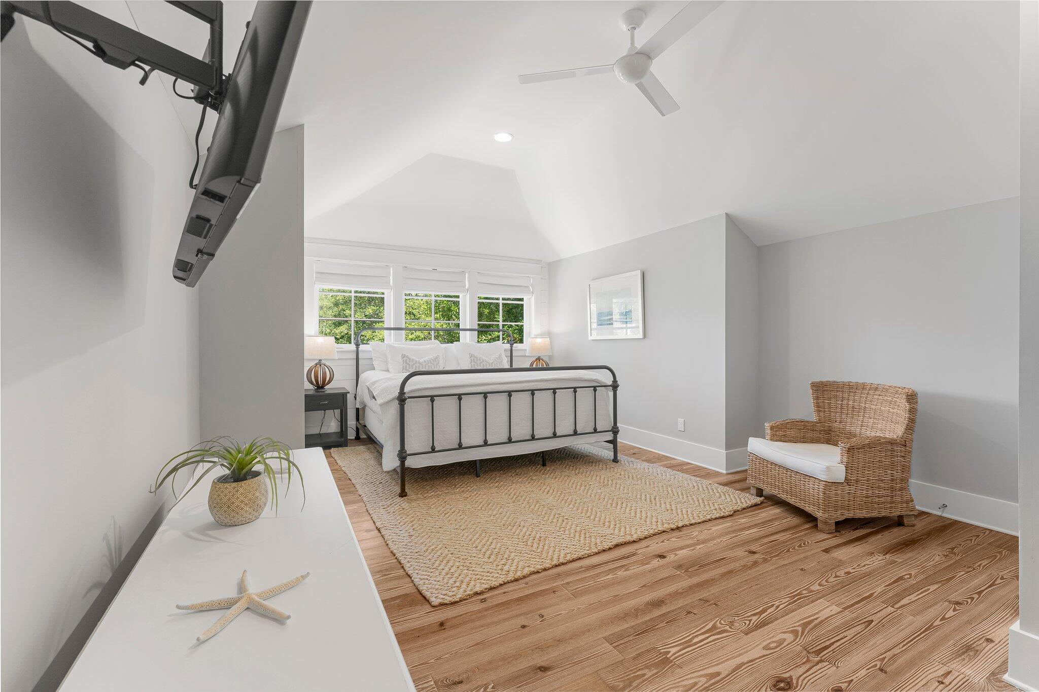 515 Seacrest Drive Inlet Beach, FL 32461 - Photo 37 of 62 a bedroom with a bed wooden floor and window