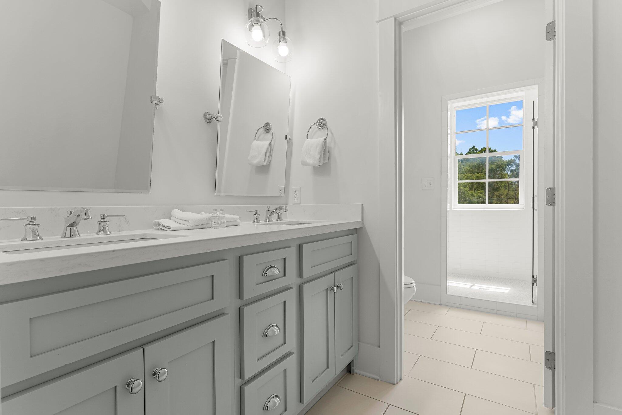 515 Seacrest Drive Inlet Beach, FL 32461 - Photo 45 of 62 a bathroom with a sink vanity and mirror