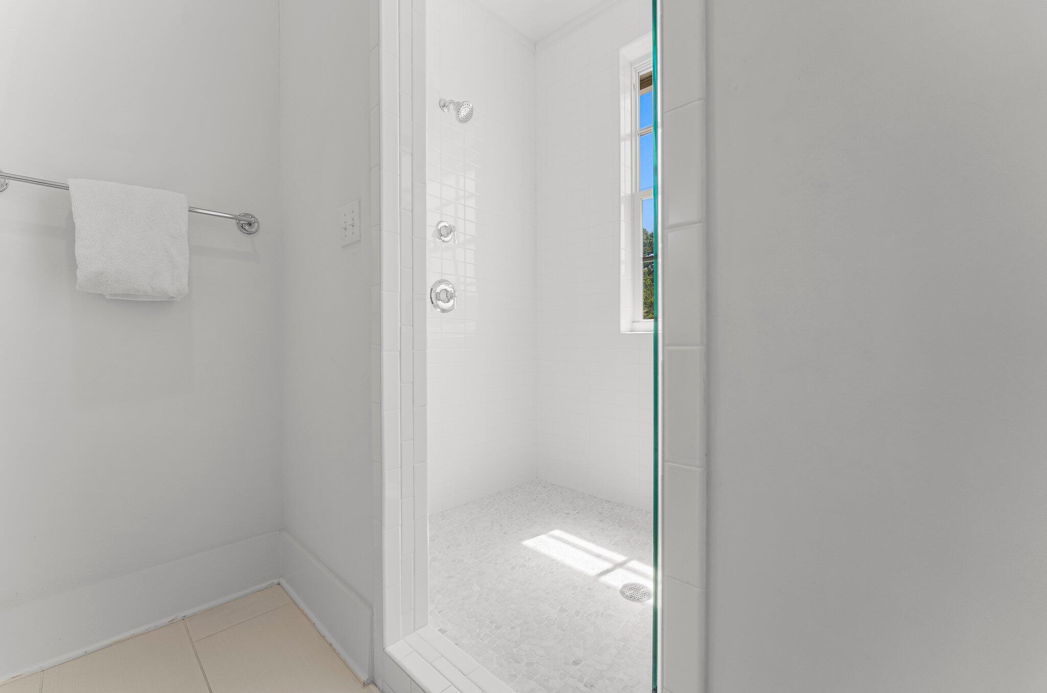 515 Seacrest Drive Inlet Beach, FL 32461 - Photo 46 of 62 a bathroom with a glass shower door