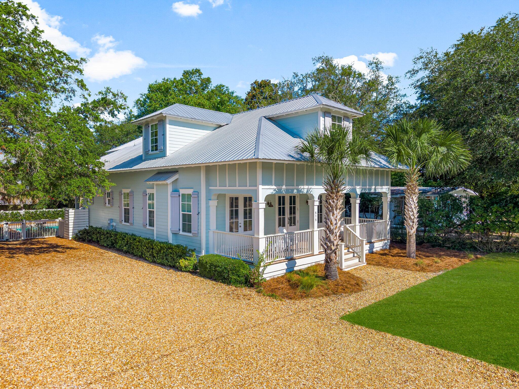 515 Seacrest Drive Inlet Beach, FL 32461 - Photo 52 of 62 a front view of a house with a yard porch and outdoor seating